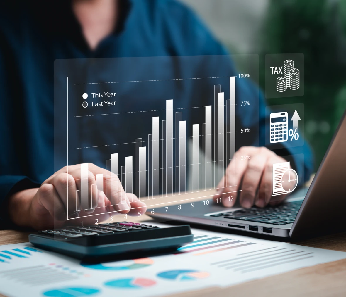 Person analyzing financial graphs on a laptop