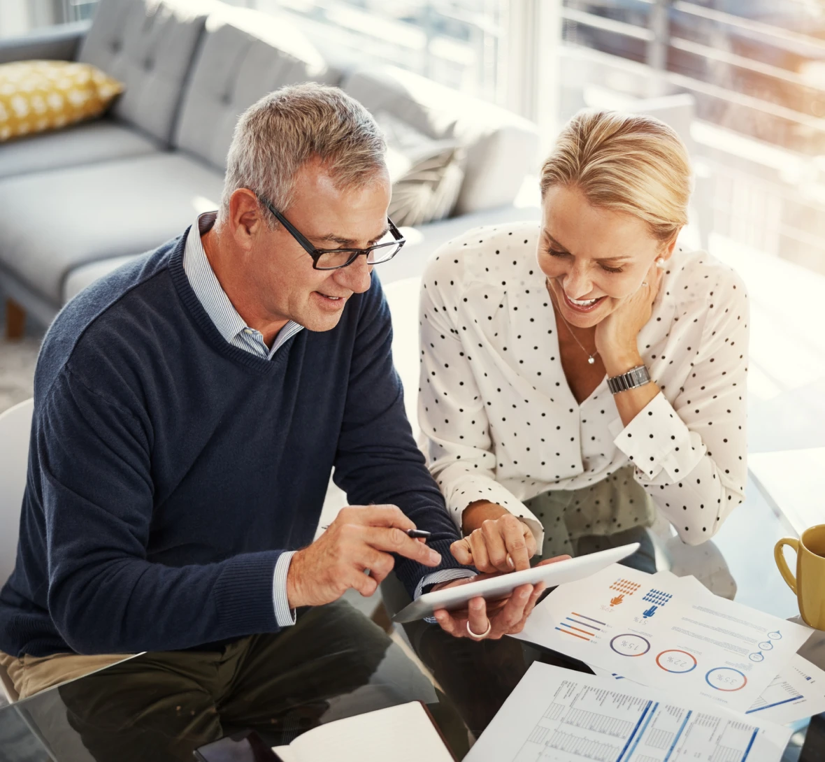 Two colleagues reviewing financial charts